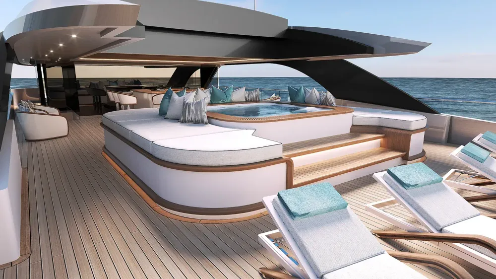 Elegant yacht deck with jacuzzi, lounge chairs, and comfortable seating overlooking the ocean.