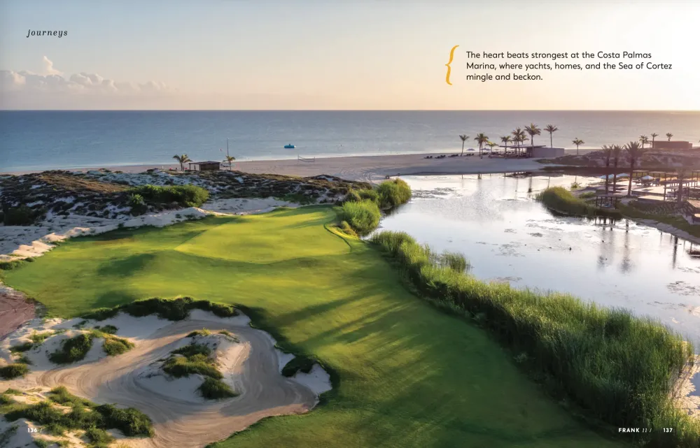 Aerial view of a lush green golf course next to a sandy beach and ocean.