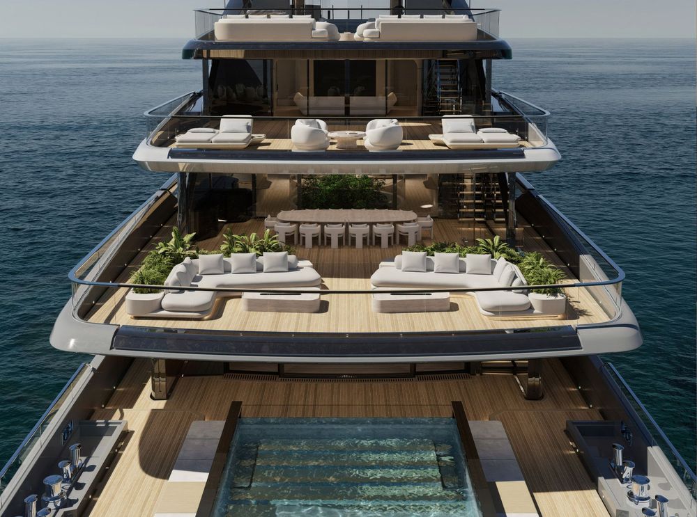 Luxury multi-deck superyacht with a glass-bottom pool and plush outdoor seating areas.