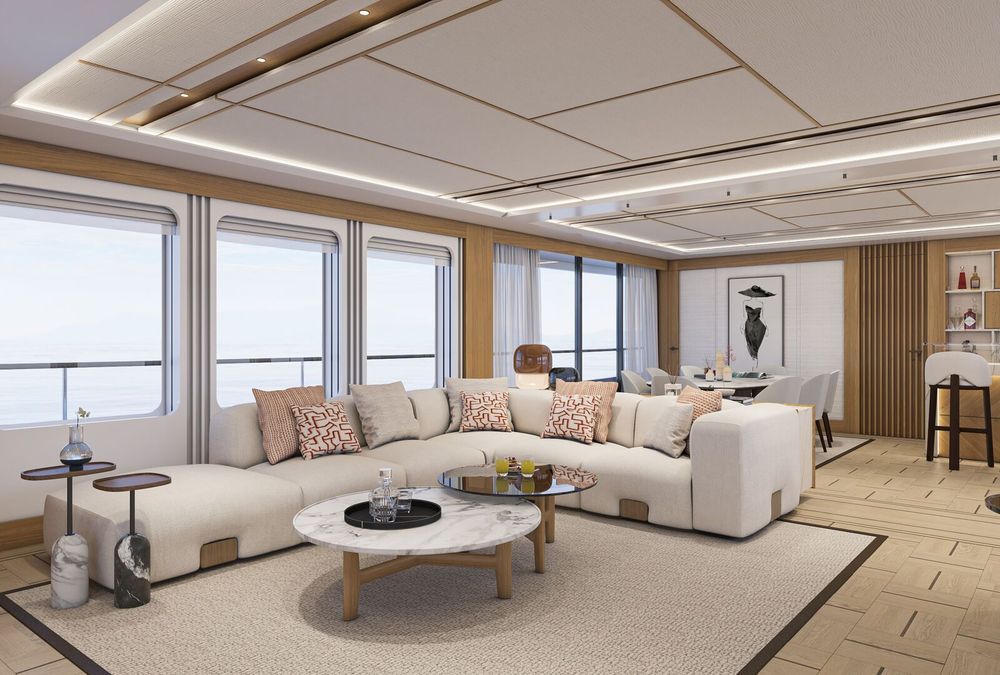 Luxurious modern living room with a large L-shaped sofa, coffee table, and sea view windows.