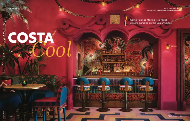 Vibrant pink bar with intricate carvings, blue stools, and 'COSTA Cool' text.