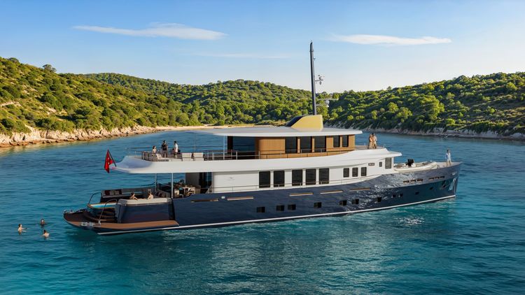 Dark blue and white yacht anchored in a clear blue cove with swimmers.